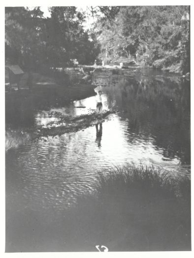 Man standing at the junction of the Cotter and Paddys Rivers