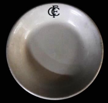 White ceramic plate inscribed with the logo of the FCC on the rim, c.1928