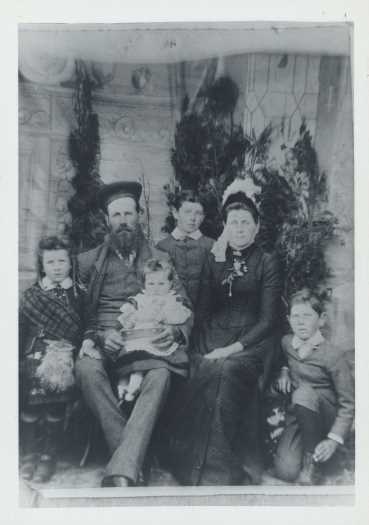 Left to right: Jim (in kilt), John Malcom with hat, Hector on knee,Stuart (at back), Ann (mother), Evelyn (kneeling). John was born 25.2.1852.