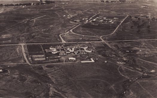 Aerial view from the west of Parliament House under construction and the Hotel Canberra