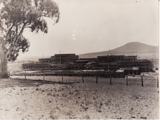 Parliament House under construction, view from rear, Mt Ainslie in background