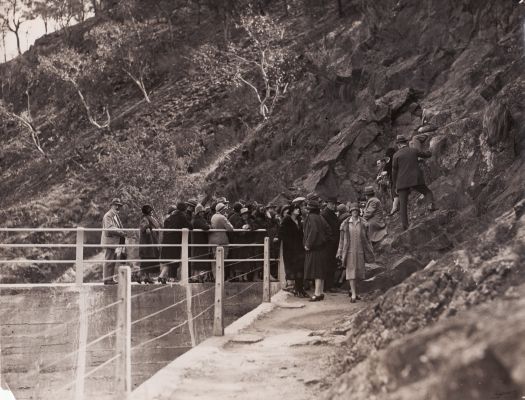 Group of people on path to Cotter Dam wall