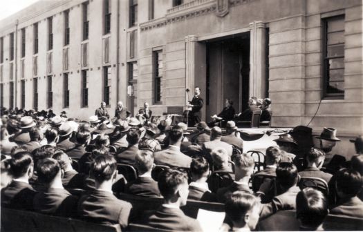 Opening of Canberra High School from NW corner - speech being given on front steps