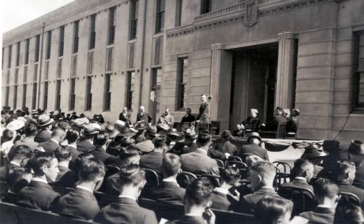 Opening of Canberra High School from NW corner - speech being given on front steps