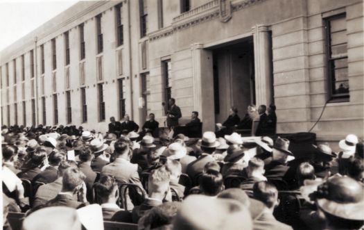 Opening of Canberra High School from NW corner - speech being given on front steps