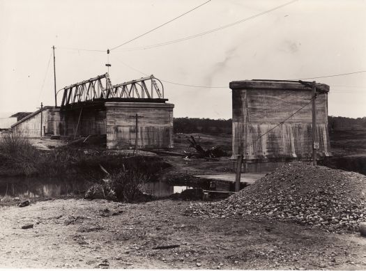 Construction of the Commonwealth Avenue bridge over the Molonglo River, showing first span in position.