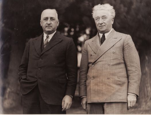 Prime Minister Joe Lyons and unidentified man.