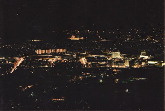 Aerial view of Canberra City by night from Black Mountain to War Memorial.