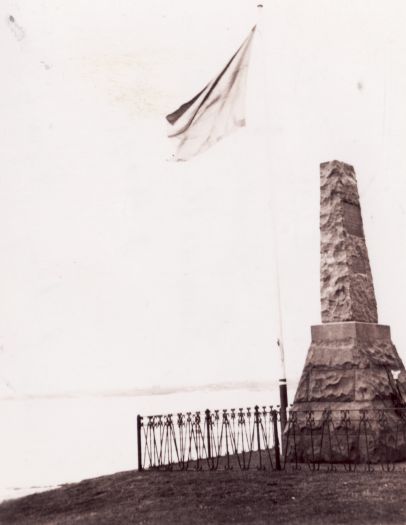 Solander memorial at Kurnell on the shore of Botany Bay. Swedish flag is flying on a mast.