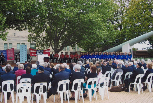 Crowd at the dedication ceremeony of a plaque to the Ordnance Field Park, western courtyard, Australian War Memorial.