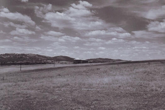 View south east from Melrose homestead to the woolshed. Red Hill at left.