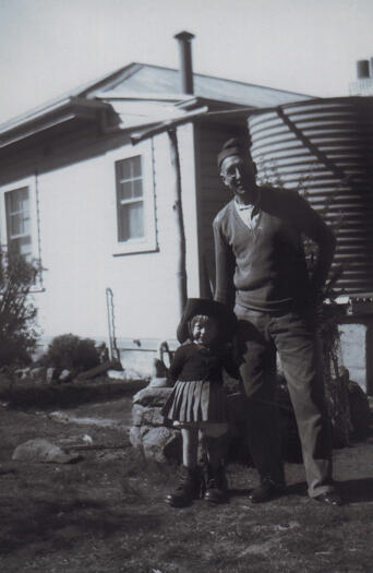 Nan Dixon, wearing her father's boots and slouch hat, and Oswald Dixon