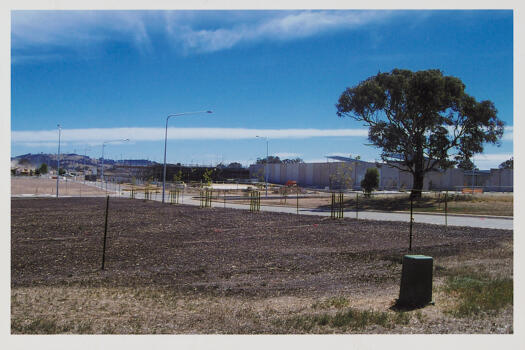 Looking north up Gungahlin Place. One of 3 photos. Construction work is visible on the left where the Big W development is being built. The Gungahlin Marketplace is visible. The Aldi and The G developments are under construction.