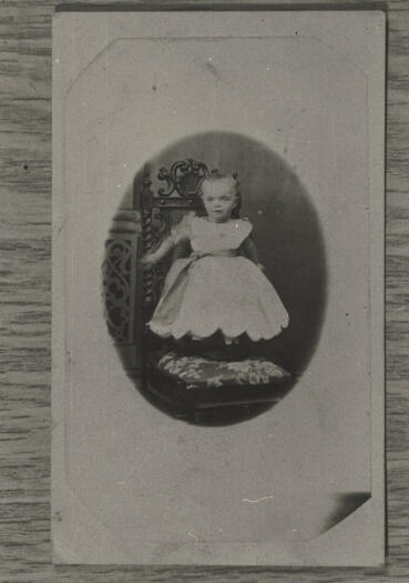 Studio portrait of a young female child. Reverse stamped 'Baxter & McDonald. Artist photographers. Cooma, Manaro.'