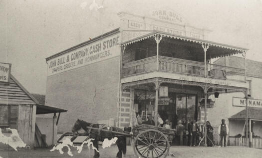 Side view of the store. Two storey building with fancy ironwork and upstairs verandah.