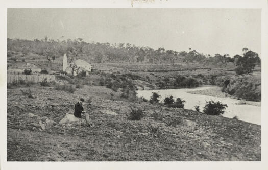 Shows Dodsworth Mill on a bend in the river. A young man sitting in the foreground could be Merlin's assistant, Charles Bayliss.