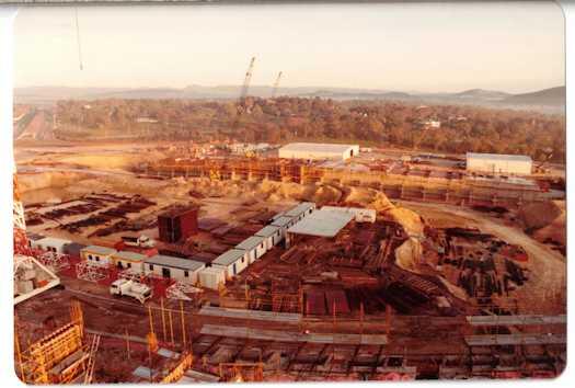 Early construction work on the Senate buildings. Yarralumla and Adelaide Avenue are visible.