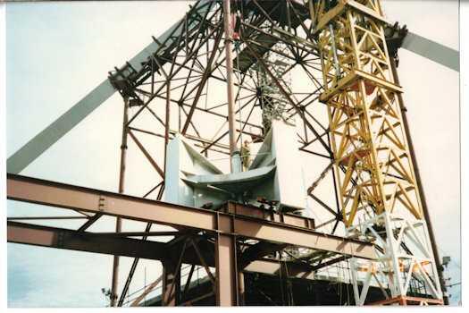 Flag pole cluster positioned on tracks