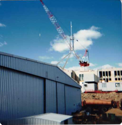 View of the flag pole and mast showing a shed at left