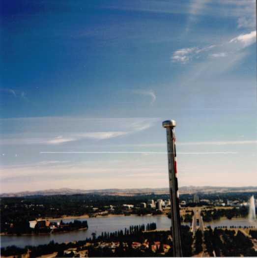 View of the top of the flag pole from the dog box. It has external ropes and a pulley system should the winch fail. The flag is limp.