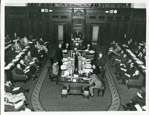 Prime Minister Gough Whitlam standing and opposition leader Billy Snedden seated in the House of Representatives chamber.
